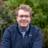 Man with fair hair and glasses